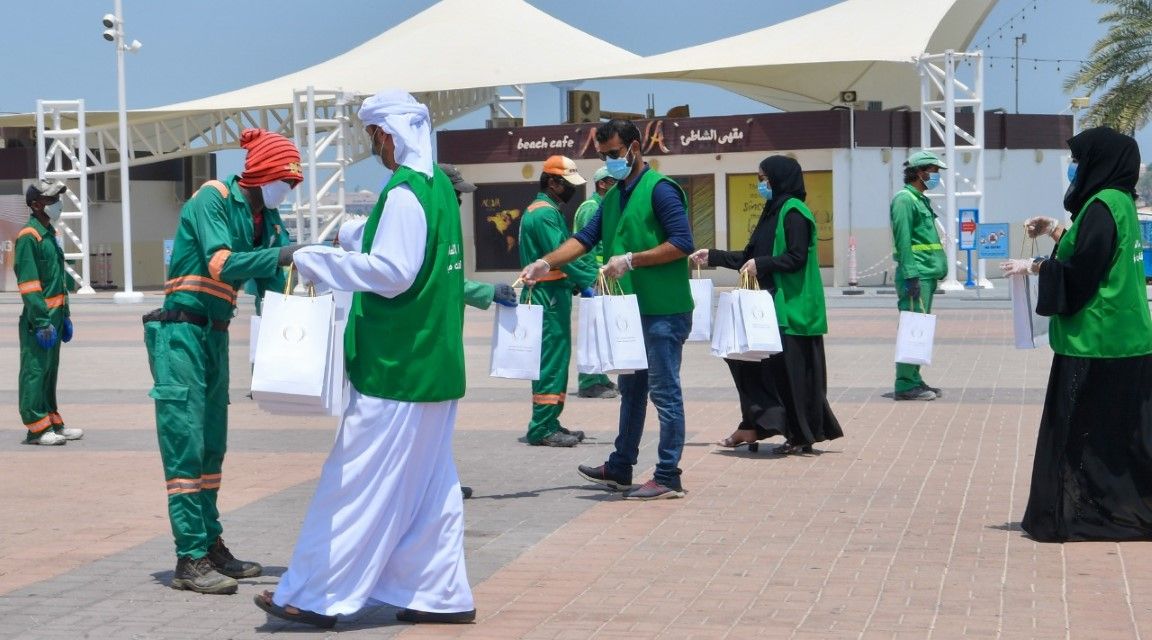 Abu Dhabi City Municipality providing water, juices, umbrellas to outdoor workers